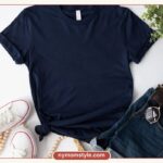 Flat lay of a navy tee, denim shorts and white sneakers, a simple capsule outfit