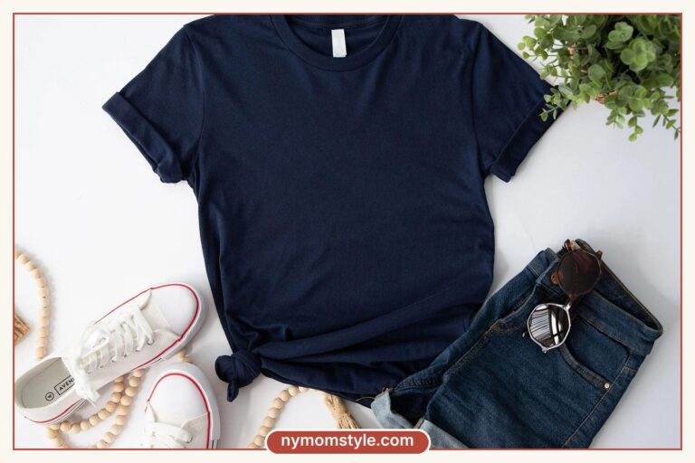 Flat lay of a navy tee, denim shorts and white sneakers, a simple capsule outfit