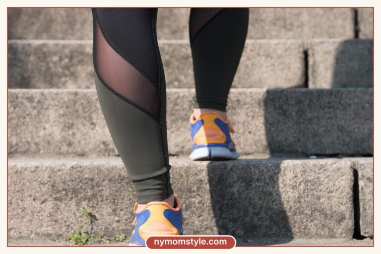 Legs in black athletic leggings and sneakers climbing stairs, an athleisure outfit