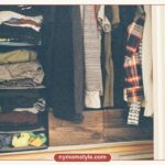 Open closet with neatly folded clothes and hanging garments, ready for a capsule wardrobe checklist