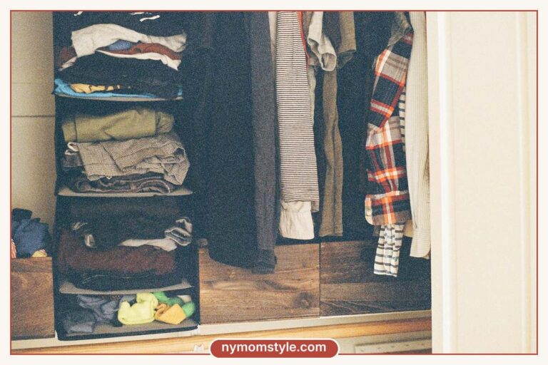 Open closet with neatly folded clothes and hanging garments, ready for a capsule wardrobe checklist