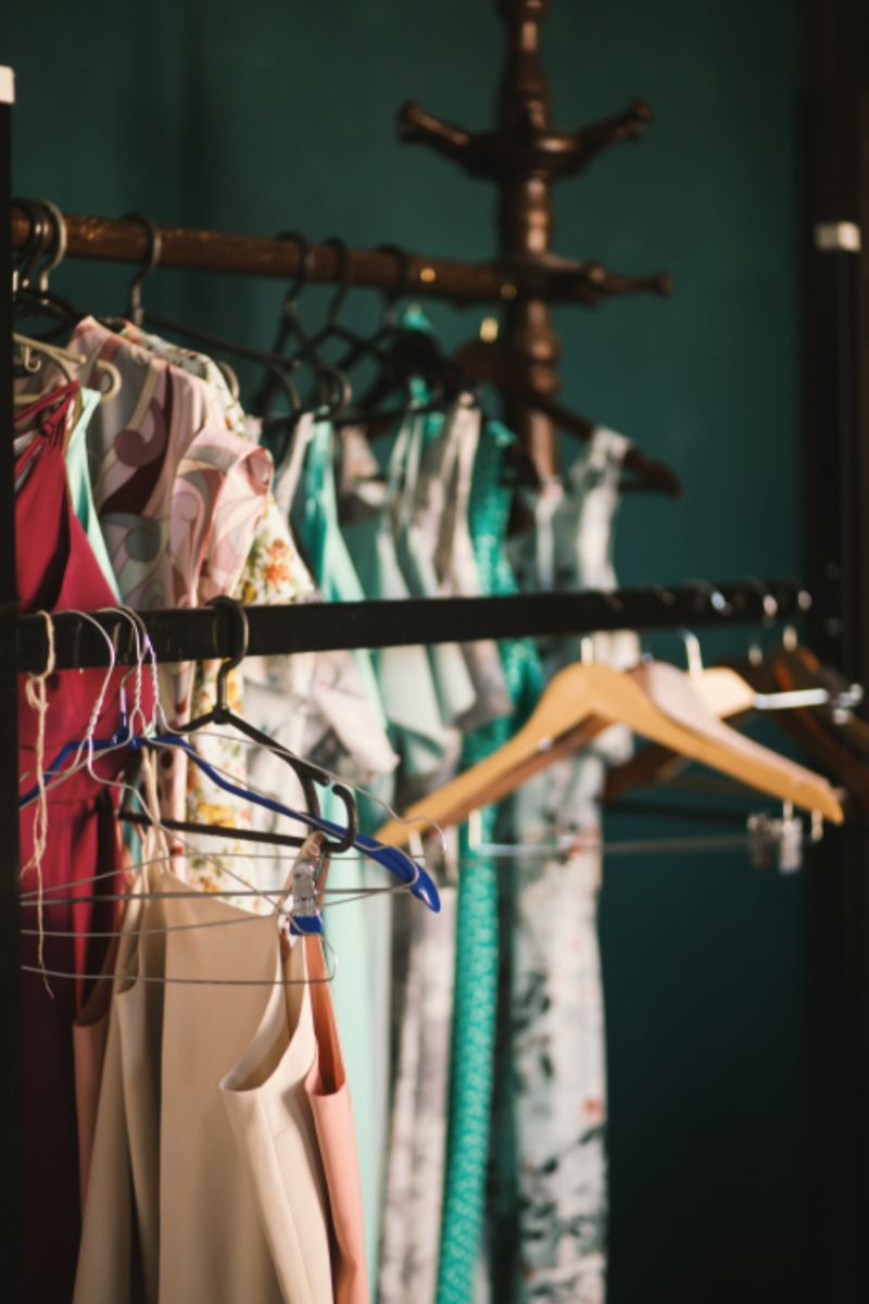 Colourful clothes on hangers on a rack, ready to mix and match