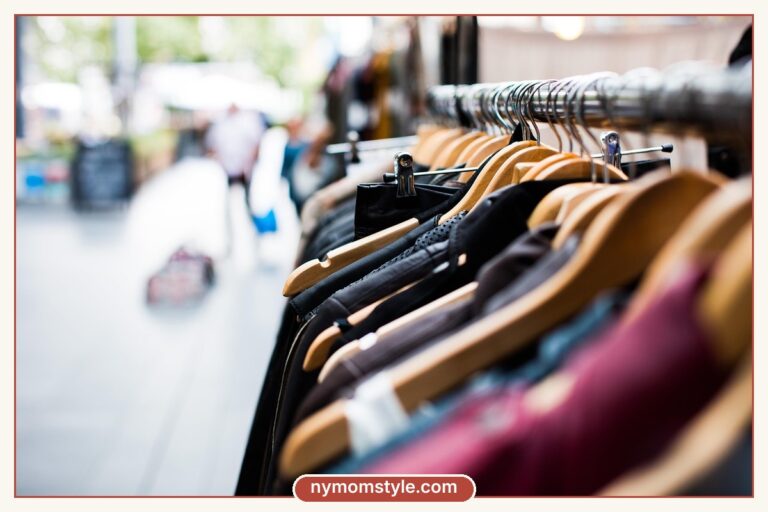 Rack of colourful clothes on hangers at a market, shopping for style on a budget